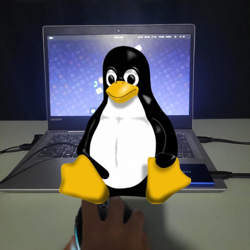 A picture of my (used to be) portable Linux setup with the Linux tux on top.
